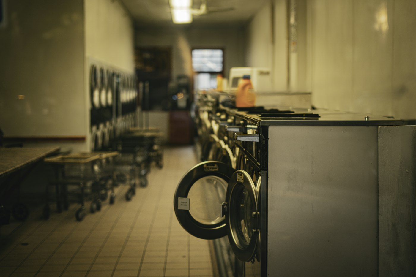 Row of commercial conveyor warewashing machines
