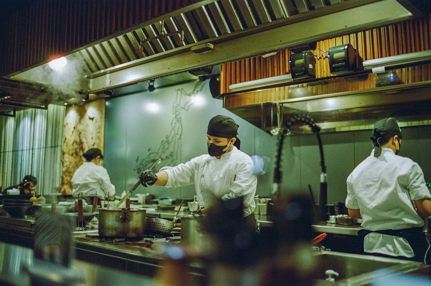 Busy commercial kitchen with chefs